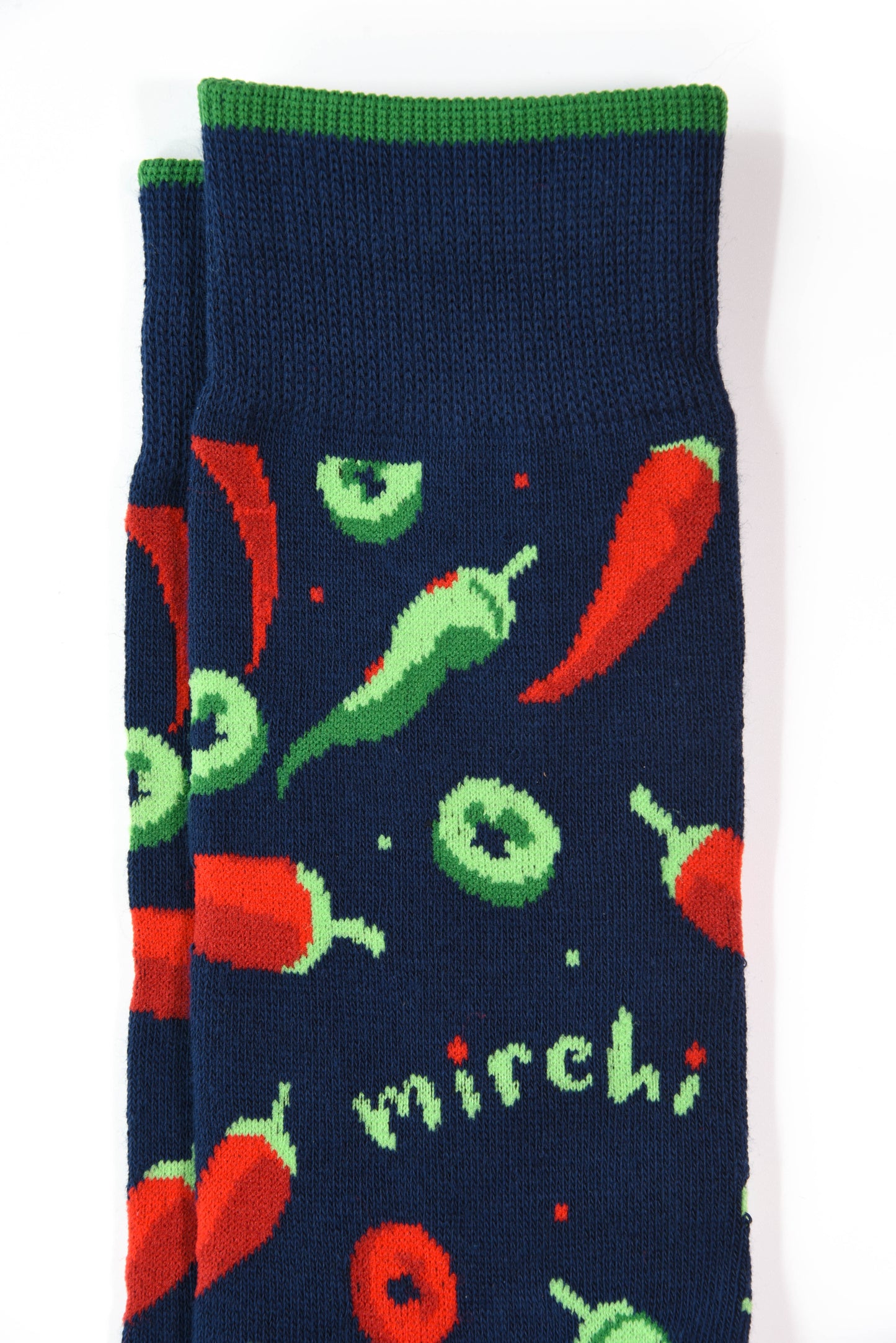 Navy blue socks with red and green chili pepper pattern on a white background